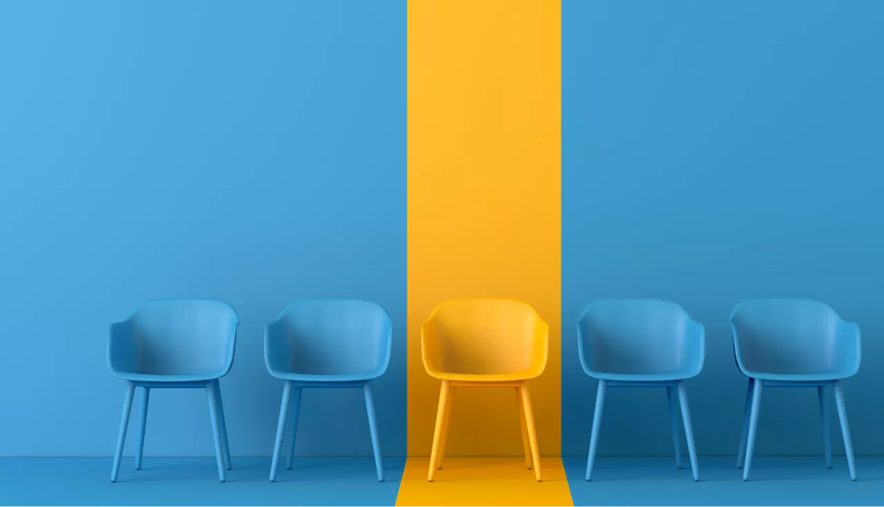 Yellow chair standing out from the crowd. 3D rendering
